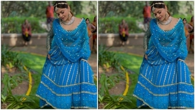 Rubina picked a blue lehenga for the shoot. The lehenga blouse is intricately decorated in silver resham threads. She paired it with a long flowy skirt with silver zari details. (Instagram/@rubinadilaik)