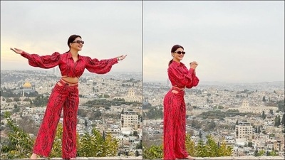 The crop top came with balloon sleeves cinched at the waist while the pants sported sultry cutouts at the waist. Both the crop top and pants sports black prints all over and came with strap details that wound around Urvashi's killer waistline for the ultimate hotness quotient. (Instagram/urvashirautela)