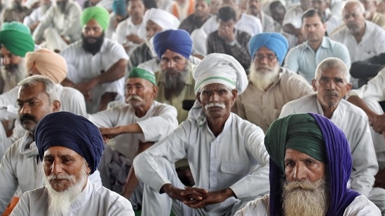 Farmers sitting on a demonstration during the ongoing farmers' protest at the Delhi-Ghazipur border, in New Delhi (ANI Photo)