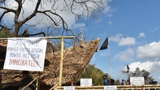 Placards and black flag are put up at the venue of Hornbill festival in solidarity with the civilians, killed in an anti-insurgency operation, in Kisama in Nagaland, on Sunday. (PTI)