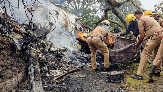 Rescue officials at work at the crash site in Coonoor, Tamil Nadu, on Wednesday,(PTI) Rescue officials at work at the crash site in Coonoor, Tamil Nadu, on Wednesday,(PTI)