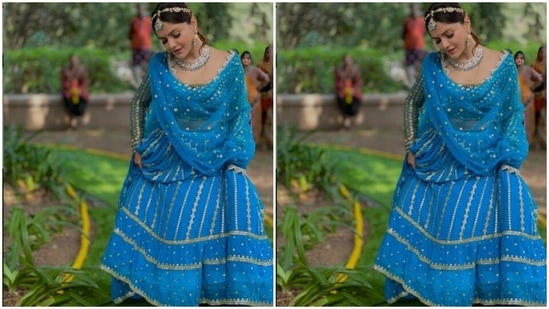 Rubina picked a blue lehenga for the shoot. The lehenga blouse is intricately decorated in silver resham threads. She paired it with a long flowy skirt with silver zari details.(Instagram/@rubinadilaik)