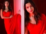 Alia Bhatt and the entire team of RRR launched the trailer of the film on Thursday, December 9. For the event, the actor decided to merge fierce and elegance and opted for an all-red lehenga saree by Sabyasachi Mukherjee.(Instagram/@_psudo_)