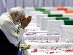 Prime Minister Narendra Modi pays tribute to the mortal remains of Chief of Defence Staff (CDS) General Bipin Rawat, his wife Madhulika Rawat and 11 other Armed Forces personnel who lost their lives in a chopper crash yesterday, at Palam airbase in New Delhi on Thursday. (ANI PHOTO) Prime Minister Narendra Modi pays tribute to the mortal remains of Chief of Defence Staff (CDS) General Bipin Rawat, his wife Madhulika Rawat and 11 other Armed Forces personnel who lost their lives in a chopper crash yesterday, at Palam airbase in New Delhi on Thursday. (ANI PHOTO)