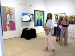 People look at contemporary art by artist Andres Valencia, 10, displayed by Chase Contemporary at Art Miami during Miami Art Week. Proceeds from Valencia's work go to the Perry J. Cohen foundation, which supports the arts, and environmental and wildlife education and preservation. (AP Photo/Lynne Sladky) People look at contemporary art by artist Andres Valencia, 10, displayed by Chase Contemporary at Art Miami during Miami Art Week. Proceeds from Valencia's work go to the Perry J. Cohen foundation, which supports the arts, and environmental and wildlife education and preservation. (AP Photo/Lynne Sladky)