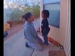 The image shows the mother talking with her kid. The image shows the mother talking with her kid. 