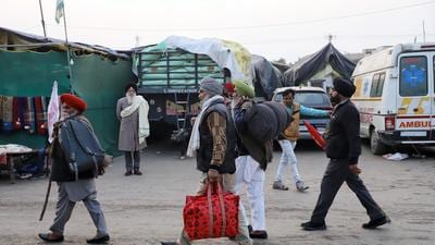 Farmers carrying their belongings leave for their native places after the Samyukt Kisan Morcha (SKM) announces the suspension of ongoing protest, at Singhu Border, in New Delhi on Thursday. (ANI) Farmers carrying their belongings leave for their native places after the Samyukt Kisan Morcha (SKM) announces the suspension of ongoing protest, at Singhu Border, in New Delhi on Thursday. (ANI)