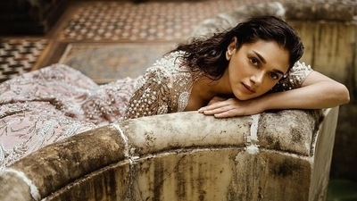 The pictures from her latest photoshoot are currently breaking the Internet and feature Aditi donning a half sleeves blouse and a high-waist lehenga that were prismatic in tone and came with peacocks peeking through intricate art nouveau frames and engineered using the finest micro-beads, pearls and ornate glass-beads. (Instagram/gauravguptaofficial) The pictures from her latest photoshoot are currently breaking the Internet and feature Aditi donning a half sleeves blouse and a high-waist lehenga that were prismatic in tone and came with peacocks peeking through intricate art nouveau frames and engineered using the finest micro-beads, pearls and ornate glass-beads. (Instagram/gauravguptaofficial)