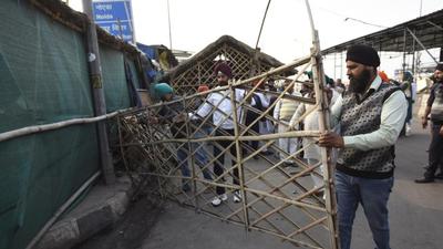 Farmers dismantle their tents at Ghazipur protest site after the agitation was called off near Ghaziabad on Thursday. (Sakib Ali/HT photo) Farmers dismantle their tents at Ghazipur protest site after the agitation was called off near Ghaziabad on Thursday. (Sakib Ali/HT photo)