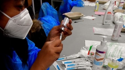 The warning from WHO came even as the doses supplied to the global vaccine sharing programme COVAX had increased in the past few months. In picture - Health worker prepares a dose of Moderna Covid-19 booster shot. (AFP | Representational Image) The warning from WHO came even as the doses supplied to the global vaccine sharing programme COVAX had increased in the past few months. In picture - Health worker prepares a dose of Moderna Covid-19 booster shot. (AFP | Representational Image)