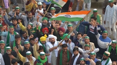 Farmers celebrate at Ghazipur border protest site after the agitation was called off following assurances from the Union government, near Ghaziabad on Thursday. (Sakib Ali /Hindustan Times) Farmers celebrate at Ghazipur border protest site after the agitation was called off following assurances from the Union government, near Ghaziabad on Thursday. (Sakib Ali /Hindustan Times)
