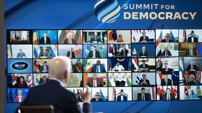 Attendees listen virtually as US President Joe Biden speaks during the Summit for Democracy in the Eisenhower Executive Office Building in Washington D.C, on Thursday. (BLOOMBERG PHOTO.) Attendees listen virtually as US President Joe Biden speaks during the Summit for Democracy in the Eisenhower Executive Office Building in Washington D.C, on Thursday. (BLOOMBERG PHOTO.)