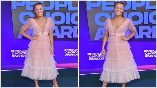 US dancer-YouTube personality JoJo Siwa looked like a vision in a soft pink ruffled dress with a plunging neckline.(AFP)