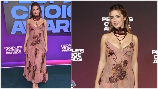 Social media personality Addison Rae makes heads turn at the red carpet as she poses in a rose gold body hugging strappy sequins dress.(AFP)