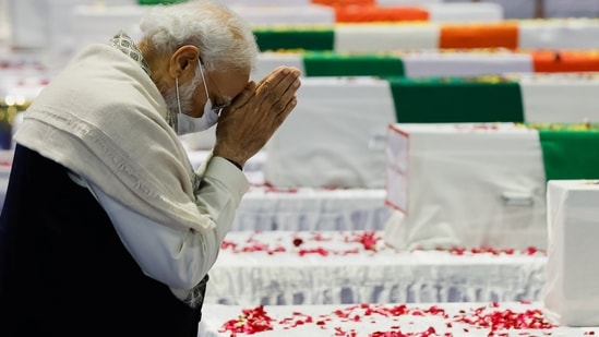 PM Narendra Modi pays homage to the mortal remains of CDS General Bipin Rawat at the Palam air base in Delhi on Thursday.(REUTERS)