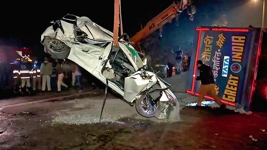 The accident, which occurred in RK Puram, nearly flattened the car. (ANI photo)