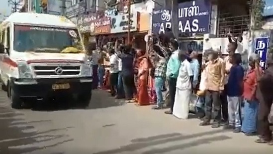 Locals can be seen chanting slogans and showering flower petals on the ambulances carrying the mortal remains of CDC Rawat and others who died in chopper crash on Wednesday.(ANI) Locals can be seen chanting slogans and showering flower petals on the ambulances carrying the mortal remains of CDC Rawat and others who died in chopper crash on Wednesday.(ANI)