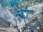 Firemen and rescue workers stand next to the debris of an Mi-17V5 helicopter crash site in Coonoor, Tamil Nadu, on Thursday. (AFP) Firemen and rescue workers stand next to the debris of an Mi-17V5 helicopter crash site in Coonoor, Tamil Nadu, on Thursday. (AFP)
