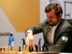 Norway's World Chess Champion Magnus Carlsen, makes a move in game five against Ian Nepomniachtchi of Russia, during the FIDE World Championship at the Dubai Expo, in Dubai, United Arab Emirates, Wednesday, Dec. 1, 2021.(AP) Norway's World Chess Champion Magnus Carlsen, makes a move in game five against Ian Nepomniachtchi of Russia, during the FIDE World Championship at the Dubai Expo, in Dubai, United Arab Emirates, Wednesday, Dec. 1, 2021.(AP)