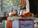 Defence minister Rajnath Singh and Brigadier LS Lidder's wife and daughter pay their last respects to him during his funeral at Brar Square, New Delhi. Defence minister Rajnath Singh and Brigadier LS Lidder's wife and daughter pay their last respects to him during his funeral at Brar Square, New Delhi.