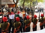 The funeral of India's first Chief of Defence Staff (CDS) General Bipin Rawat, his wife Madhulika and Brigadier Lakhwinder Singh Lidder is being held on Friday. According to news agency PTI, the bodies of General Rawat and his wife Madhulika will be kept at their Kamaraj Marg residence from 11am to 12:30pm for the general public to pay their final respects.(HT Photo/Vipin Kumar)