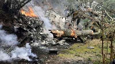 The chopper went up in flames after it crashed in Coonoor on Wednesday. (ANI) The chopper went up in flames after it crashed in Coonoor on Wednesday. (ANI)