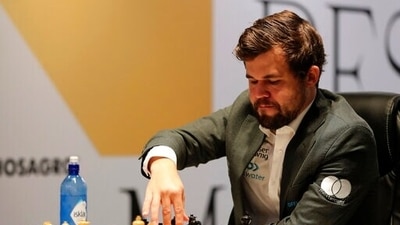 Norway's World Chess Champion Magnus Carlsen, makes a move in game five against Ian Nepomniachtchi of Russia, during the FIDE World Championship at the Dubai Expo, in Dubai, United Arab Emirates, Wednesday, Dec. 1, 2021. (AP) Norway's World Chess Champion Magnus Carlsen, makes a move in game five against Ian Nepomniachtchi of Russia, during the FIDE World Championship at the Dubai Expo, in Dubai, United Arab Emirates, Wednesday, Dec. 1, 2021. (AP)