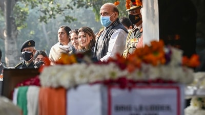 Defence minister Rajnath Singh and Brigadier LS Lidder's wife and daughter pay their last respects to him during his funeral at Brar Square, New Delhi. (PTI) Defence minister Rajnath Singh and Brigadier LS Lidder's wife and daughter pay their last respects to him during his funeral at Brar Square, New Delhi. (PTI)