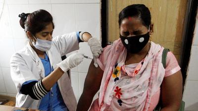A beneficiary reacts while receiving a dose of the Covid-19 vaccine at a vaccination camp in the wake of the new coronavirus variant Omicron, in Prayagraj on Friday. (ANI) A beneficiary reacts while receiving a dose of the Covid-19 vaccine at a vaccination camp in the wake of the new coronavirus variant Omicron, in Prayagraj on Friday. (ANI)