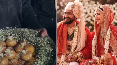 Katrina Kaif and Vicky Kaushal distributed sweets outside the venue, after their wedding. Katrina Kaif and Vicky Kaushal distributed sweets outside the venue, after their wedding.