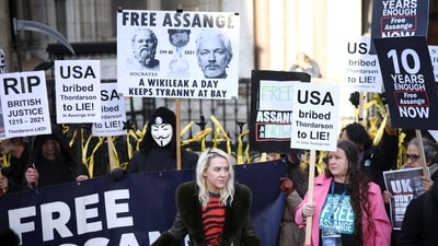 Supporters of Julian Assange display signs and banners, outside the Royal Courts of Justice in London, Britain. (Reuters)