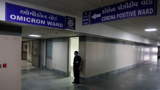 A security guard stands in position outside a ward being prepared for the omicron coronavirus variant at Civil hospital in Ahmedabad.(AP)