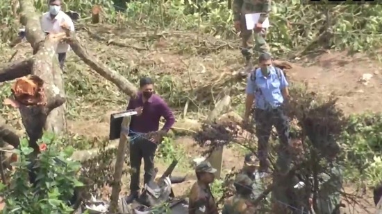 Teams of the IAF and local police personnel at the crash site on Friday. (ANI Twitter)