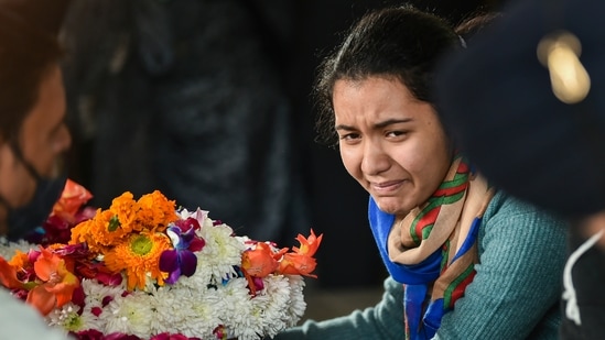 Daughter of late Brigadier LS Lidder breaks down as she pays last respects to her father at Brar Square, Delhi Cantt, in New Delhi.(PTI)