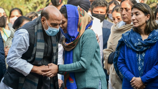 Union defence Minister Rajnath Singh shares condolences with the daughter and wife of Brigadier LS Lidder as they pay their last respects to him during his funeral at Brar Square, Delhi Cantt, in New Delhi.(PTI)