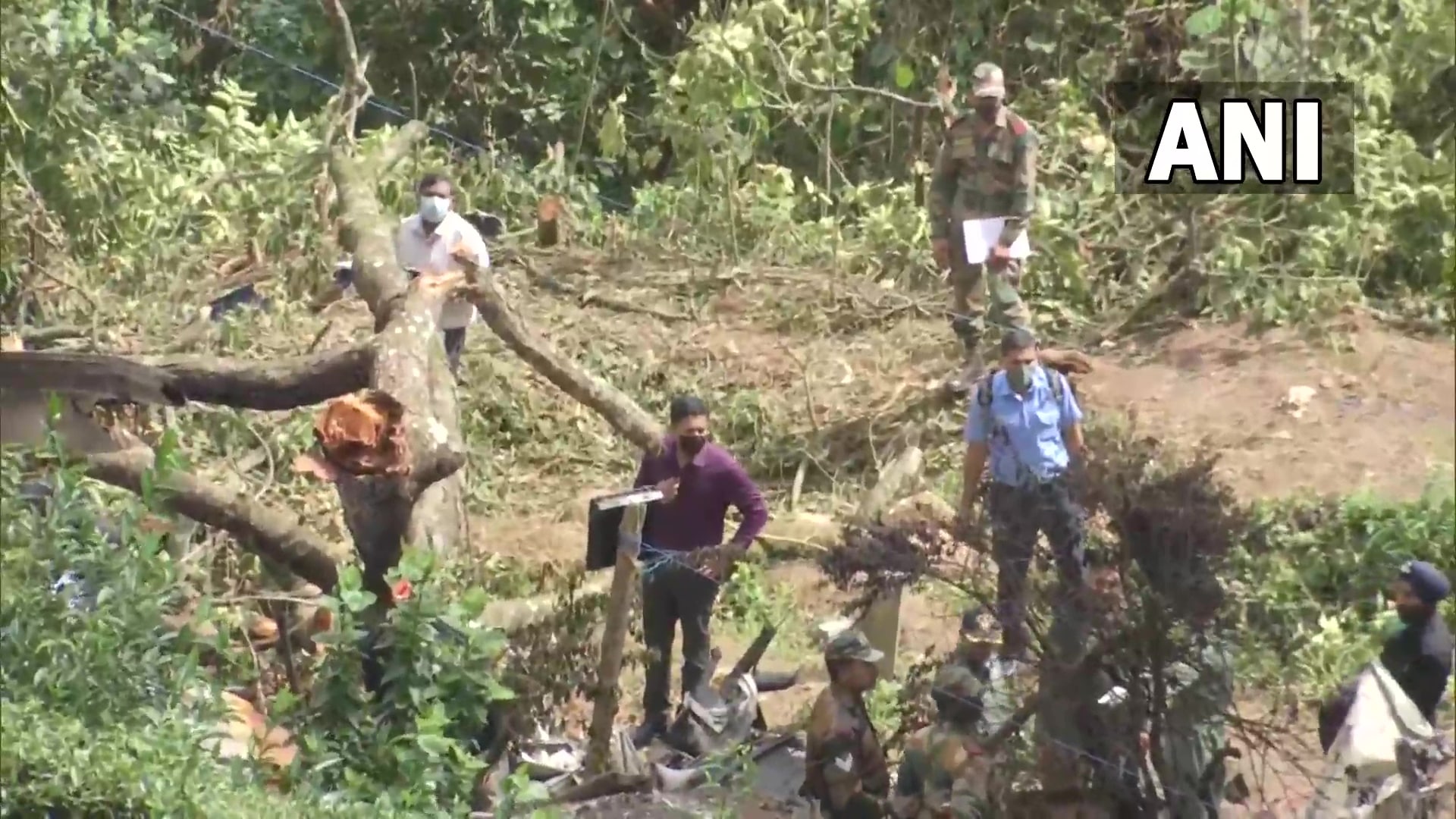 Teams of the IAF and local police personnel at the crash site on Friday. (ANI Twitter) Teams of the IAF and local police personnel at the crash site on Friday. (ANI Twitter)