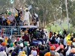Farmers celebrate on the road while returning from Delhi after calling off a protest against three farm laws and other issues at Shambhu Border, in Patiala on Saturday. (Harmeet Sodhi) Farmers celebrate on the road while returning from Delhi after calling off a protest against three farm laws and other issues at Shambhu Border, in Patiala on Saturday. (Harmeet Sodhi)