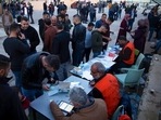 Palestinians look for their polling station to cast their votes during municipal elections, in the West Bank village of Kifl Haris, Saturday. Palestinians look for their polling station to cast their votes during municipal elections, in the West Bank village of Kifl Haris, Saturday.