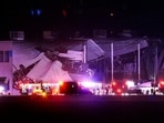 The Amazon distribution centre is partially collapsed after being hit by a tornado on Friday. The Amazon distribution centre is partially collapsed after being hit by a tornado on Friday.