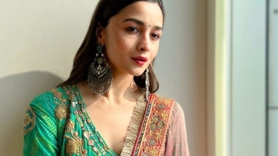 It was layered with a contrasting sheer pink dupatta that was lined with beautiful kiran lace and a multicoloured broad border lining the dupatta. The ensemble is credited to Indian fashion label Rimple &amp; Harpreet Narula. (Instagram/aliaabhatt)