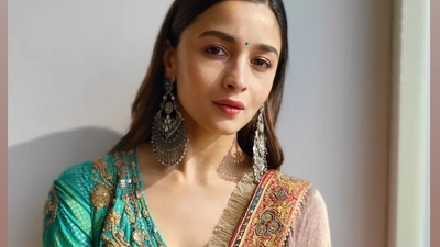 Accessorising her look with a pair of statement silver earrings and a tiny green bindi, Alia amplified the glam quotient with a dab of pink lipstick, rosy blushed and highlighted cheeks, mascara-laden eyelashes and filled-in eyebrows. (Instagram/aliaabhatt)