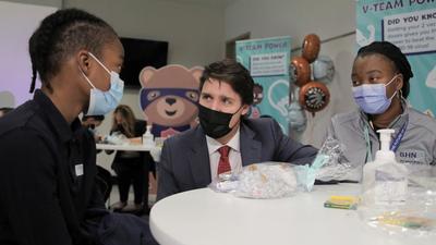 Canada’s Prime Minister Justin Trudeau (centre) visits a Covid-19 vaccination clinic for children at Scarborough Health Network’s Centenary Hospital in Scarborough, Ontario, on Friday. Of the entire Canadian population, 81% have received one dose of a Covid-19 vaccine, while 76% are fully jabbed. (REUTERS) Canada’s Prime Minister Justin Trudeau (centre) visits a Covid-19 vaccination clinic for children at Scarborough Health Network’s Centenary Hospital in Scarborough, Ontario, on Friday. Of the entire Canadian population, 81% have received one dose of a Covid-19 vaccine, while 76% are fully jabbed. (REUTERS)
