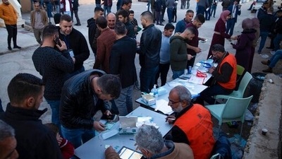 Palestinians look for their polling station to cast their votes during municipal elections, in the West Bank village of Kifl Haris, Saturday. (AP) Palestinians look for their polling station to cast their votes during municipal elections, in the West Bank village of Kifl Haris, Saturday. (AP)