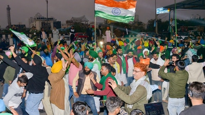 Farmers dance as they celebrate at the Ghazipur border after a decision to withdraw farmers-movement in the wake of the government accepting all demands put forward by the agitating farmers. (PTI) Farmers dance as they celebrate at the Ghazipur border after a decision to withdraw farmers-movement in the wake of the government accepting all demands put forward by the agitating farmers. (PTI)