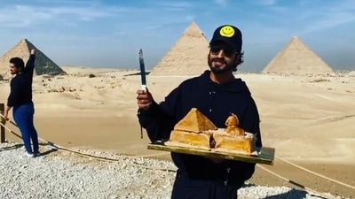 Vidyut Jammwal is holding his birthday cake that is a small replica of the Great Pyramid of Giza. (Instagram/@mevidyutjammwal)