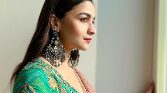 Taking to her social media handle, Alia shared a slew of pictures that featured her donning an kalidar kurta that came in turquoise base and was teamed with a pair of indigo pants, both of which sported multicoloured embroidery and gota works.(Instagram/aliaabhatt)