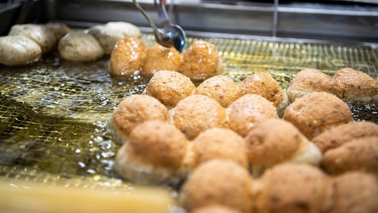 Baker Gerboin fries dough in oil obtained from leftover bread in his bakery in Moosinning near Munich, Germany,(Photo: Lukas Barth, Reuters)