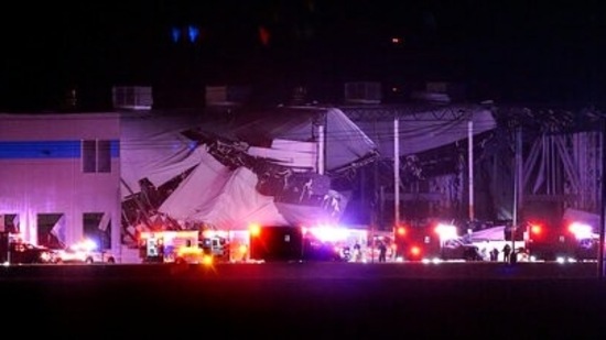 The Amazon distribution centre is partially collapsed after being hit by a tornado on Friday. (AP)