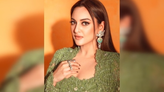 With sleek straightened hair parted in the middle and a few strands framing her face, Sonakshi Sinha rocked the contemporary Indian look.(Instagram/@aslisona)