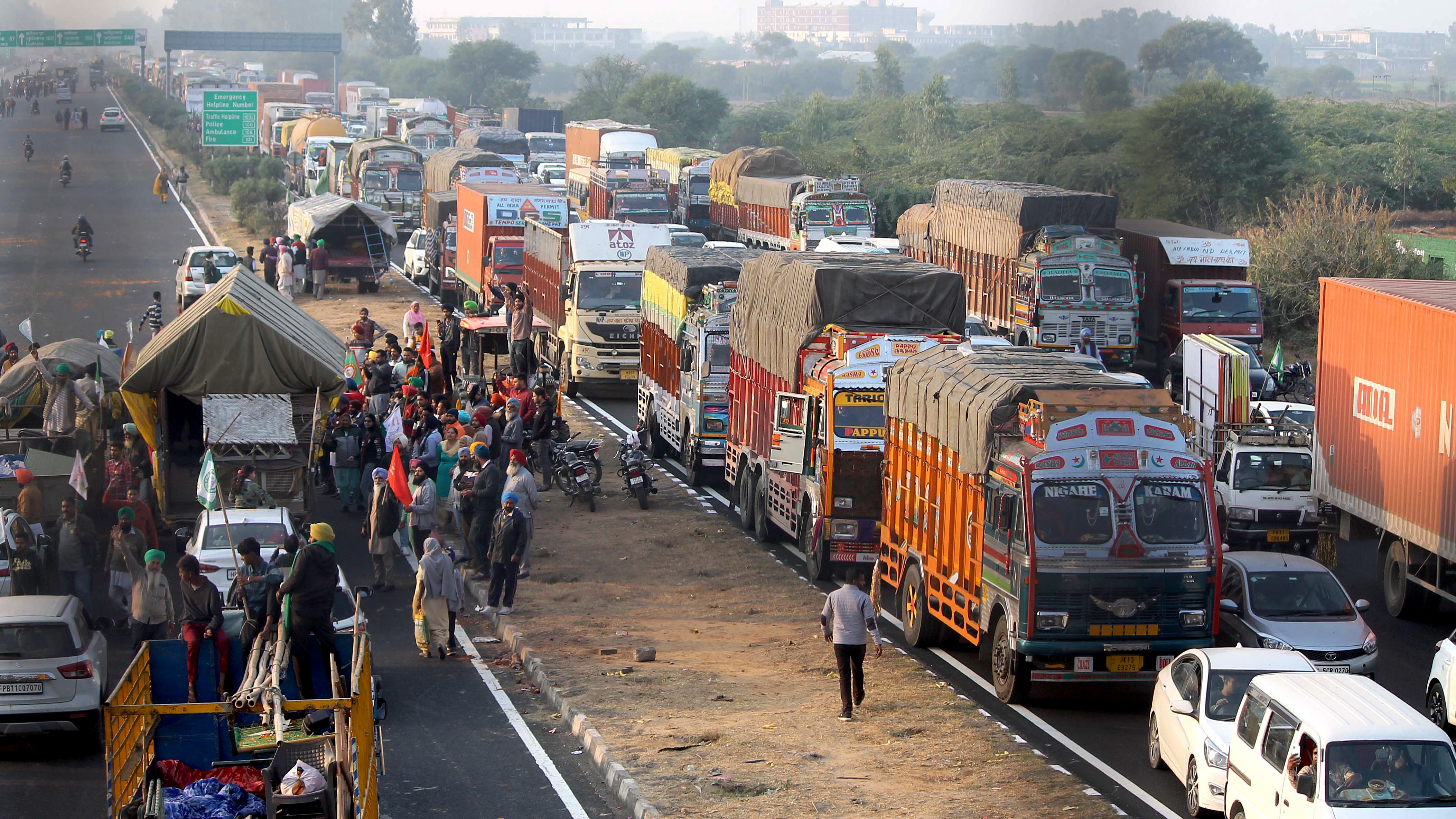 Farmers celebrate on the road while returning from Delhi after calling off a protest against three farm laws and other issues at Shambhu Border near Patiala on Saturday. (ANI) Farmers celebrate on the road while returning from Delhi after calling off a protest against three farm laws and other issues at Shambhu Border near Patiala on Saturday. (ANI)